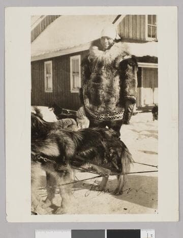 Jack London in snow with sled dogs