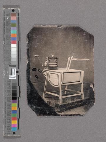 View of a clothes washing machine on a small platform