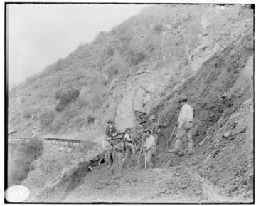 A group of men clearing a landslide on the Mill Creek #2 Hydro Plant line