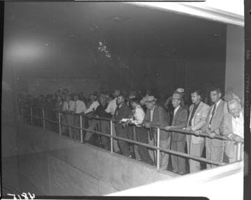 Group touring the interior of the newly operating Big Creek Powerhouse #4 with its two vertical axis, Francis turbine generators