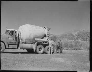 Airlifting wet concrete into transmission tower sites in Soledad Canyon for tower footings with large Sikorsky helicopter