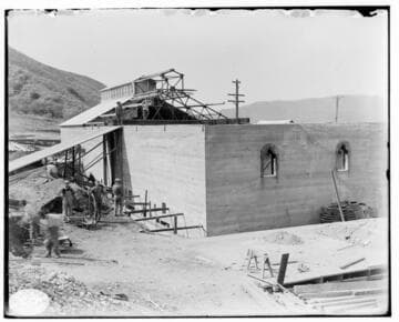 A construction crew putting up the roof and trusses at Mill Creek #3 Hydro Plant