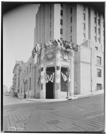 Front entrance of Edison Building with Olympic Flags display