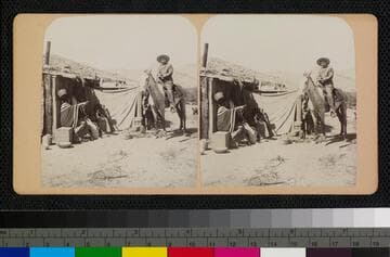 Hualapai Indian on a horse and a woman in front of a Hualapai house