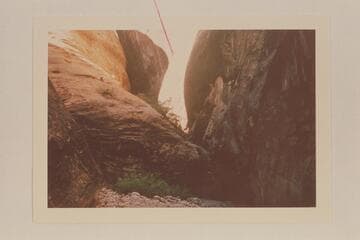 Drop-off at foot of Surprise Valley in Nasja Creek.  Turner states that it is not difficult to traverse this section of the canyon on foot.  [notation on page with red line pointing to top center area of photo:  "pecked steps"]