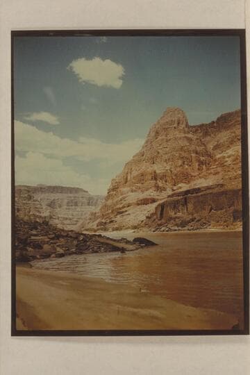Upriver view from the lower end of the beach at Spring Canyon.  Margaret Marston in swimming at the point in the foreground