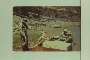 Frost party in the Goosenecks of the San Juan.Left to right:  Walter Pelzner; Glennon Robinson (boatman); Robert A. Uihlein (sitting in stern, VP of Schlitz Brewing Co.); Owen Gromme (Curator of Milwaukee Public Museum)