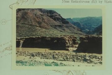 Three Springs Canyon at Mile 215 1/2 from island that is submerged at high water and joins the right bank in low water