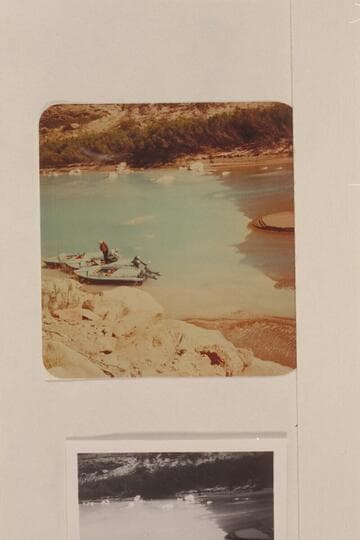 The three aluminum outboard powered boats moored in the clear lagoon at the mouth of the Little Colorado River