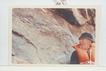 Dock Marston posed at the 1836 D. Julien inscription at Mile 185.75 Cataract Canyon