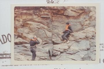 Bill Belknap photographs Dock Marston posed by the 1836 D. Julien inscription at Mile 185.75 in Cataract Canyon