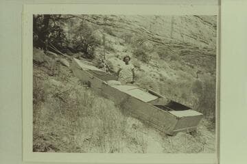 Nevills posing by the Loper boat at Mile 41