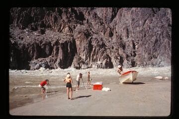 Damaged "Wee Red" on beach; Monument Creek Rapid