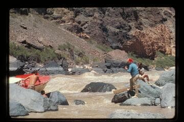 "Wee Red" on rocks; Vulcan Rapids