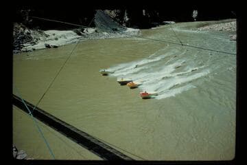 Four boats up under Bright Angel Bridge