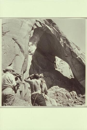 Masland registers satisfaction in the sight of the hole back of the arch.  Marston and Visbak photograph the register.  Masland has suggested the arch be named Arch in the Sky.  It is believed to be a discovery