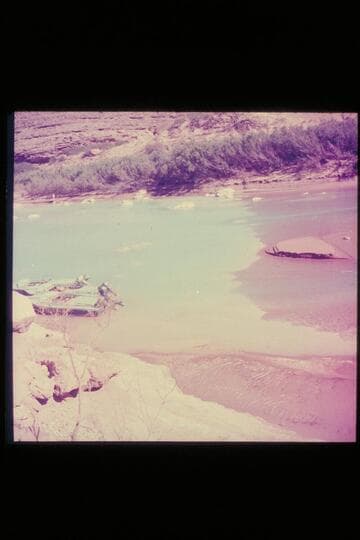 The three boats of the 1954 outboard fleet moored in the clear lagoon at the mouth of the Little Colorado River