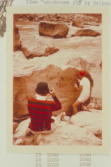 Dock photographs Jorgen Visbak who points up the Best Expedition inscription at Mile 204 1/2.  Best Wreck Rapid