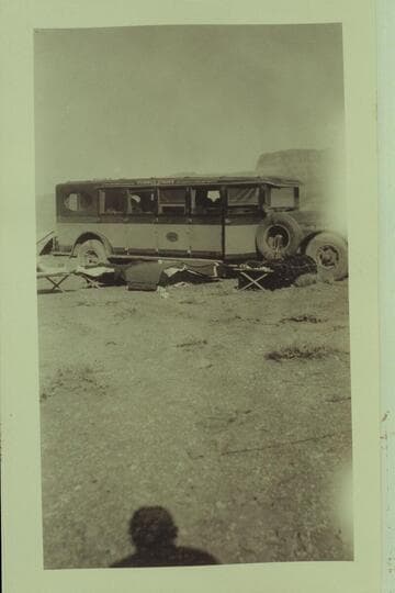 Bus and sleeping gear at Marble Canyon Bridge dedication.  Print from Freeman collection
