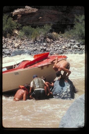 "Wee Red" on rocks; Vulcan Rapids