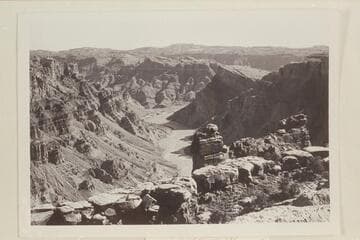 Down Cataract Canyon from the rim at approximately Mile 210 and down river from the mouth of Surprise Valley