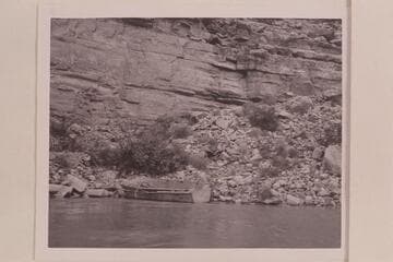 The storm boat going to pieces on the talus at Mile 40