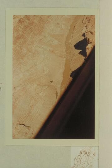 Up river from Mile 198.2.  The river appears at top at Mile 199.6 and is hidden by the edge of the plane at Mile 198.7.  The Rapid is #28