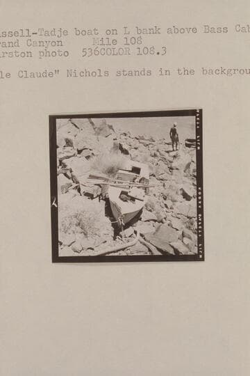 Russell-Tadje boat on left bank above Bass Cable.  Grand Canyon, Mile 108.  "Ole Claude" Nichols stands in the background