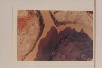 Junction of the Green and Colorado Rivers.  The Green enters from the left.  The Colorado comes from the top of the print.  Approximate gauge:  30,000 cfs.?