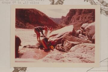 Bill and Buzz Belknap portage a Sportyak at Rapid 23