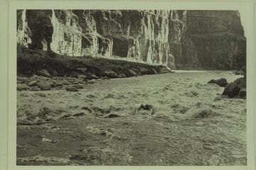 The "Bootoo" entering the head of Lava Falls.  Left to right:  Marston, Masland.  About 5 PM