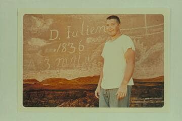 Daniel Julien at the inscription in Hell Roaring Canyon