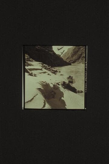 Jim Jordan's outboard moored above Bridge Canyon Rapid waiting for the arrival of the Wright-Rigg cruisers