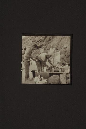 Digging in for chow at Diamond Creek.  Hugh Cutler; Willie Taylor; Rod Sanderson; Joe Desloge; Marston.  Note the coffee grainder