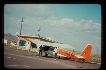 Ron Smith's plane at the Kanab Airport.  Art Gallenson at left; John Hoffman at right