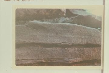 A scratched Julien or Julian inscription on the overhang below the Fort at White Canyon