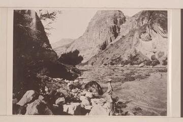 Looking downstream from head of Lava Falls.  Koms with straw hat.  Moore with white cap.  Photo from Lint album