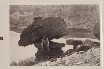 Robert N. Allen beside balanced rock.  San Juan River to left, Colorado River to right.  Used as Complainant's Exhibit No. 388 in River Bed Case
