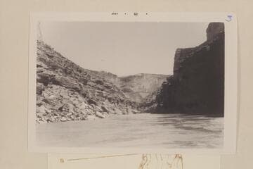 Upstream from Mile 14.3, or about 1/10 miles above Sheerwall Rapid
