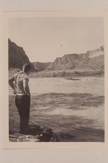 Edward Hudson watches the "Esmeralda" with Ed Hudson at the controls immediately after it was put in the river at Lees Ferry