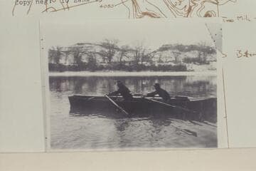 Edwin T. Wolverton and his son, Norville, on the Green River in a skiff built at his home in Green River, Utah, by Edwin T. Wolverton