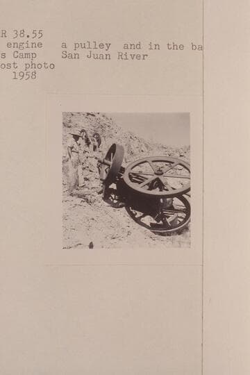The gas engine, a pulley and in the background- the rock crusher.  Spencer's Camp, San Juan River
