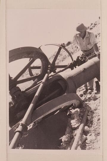 Jack Frost examines the old gas engine at Spencer's Camp