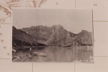 Dubendorff holds his boat at the mouth of Flaming Gorge as Cogswell takes his photo