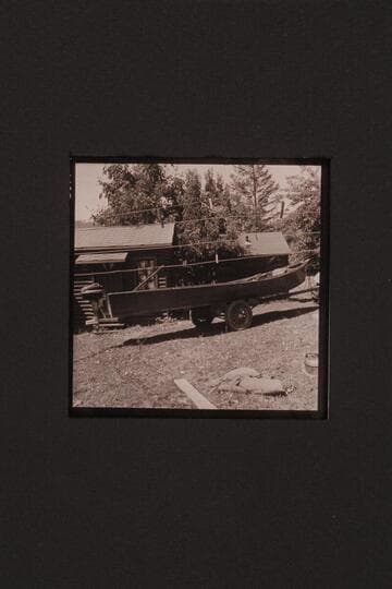 Rogue River type of boat.  Two boats at Agness on the Rogue River.  Outboard motor on stern of one boat