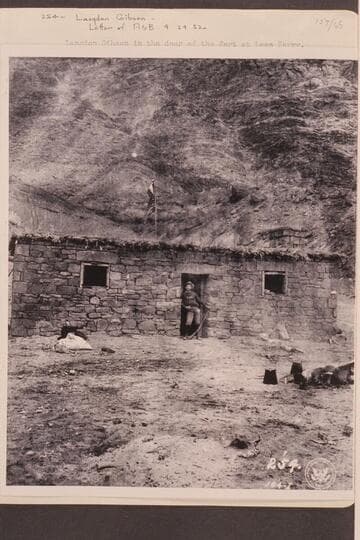 Langdon Gibson in the door of the fort at Lees Ferry.  Gibson was a member of the Stanton crew which traversed Marble and Grand Canyons