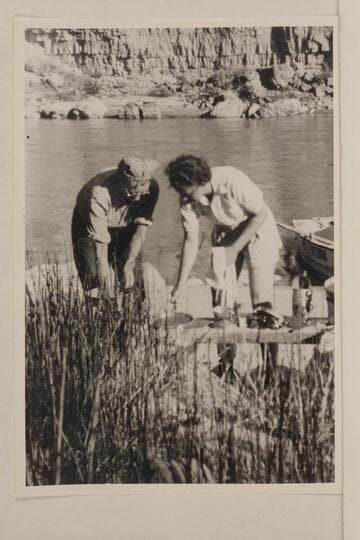 Millie Baker and Doris Nevills washing dishes on the 1940 river trip