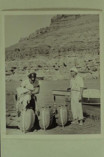 Jimmy Jordan explaining to Marston the finer features of the Evinrude motors, Paria Riffle