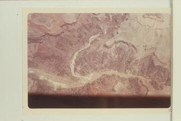 Bright Angel Creek at its mouth with Phantom Ranch at the left bank about a half mile from the Colorado River.  The suspension bridge is above the mouth.  The scouring from the flood of 1966, Dec., shows plainly