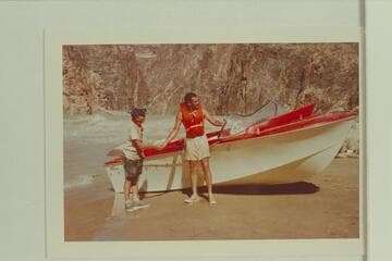 Ed I'Anson congratulates Garth Marston on the ride in Monument Creek Rapid.  Bill Austin had tried an up run and got fouled in a hole and then pounded a rock before running high and dry onto the beach